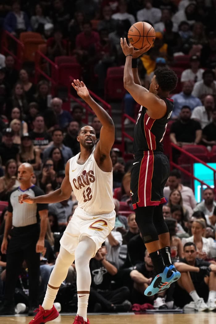 Dec 8, 2023; Miami, Florida, USA; Miami Heat guard Kyle Lowry (7) shoots over Cleveland Cavaliers center Tristan Thompson (12) during the second half at Kaseya Center.